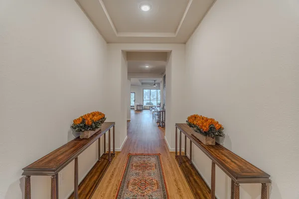 a hallway with toys and wooden floor