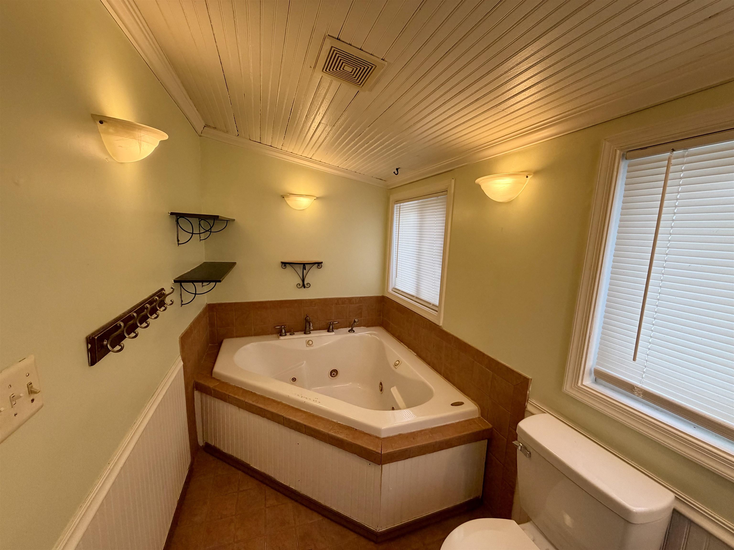 3648 Middlebrook Village Road Middlebrook, VA 24459 - Photo 14 of 48 a bathroom with a bathtub and a window