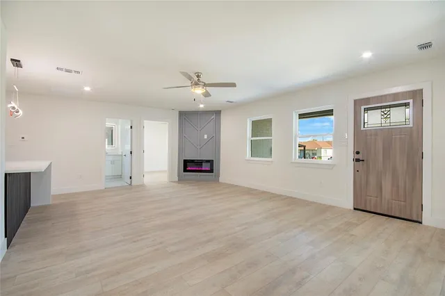 a view of an empty room with a window