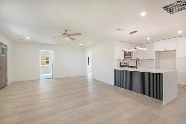 a view of kitchen with wooden floor and window