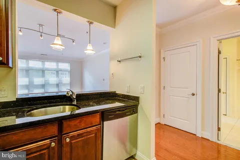 a kitchen with a sink and a refrigerator