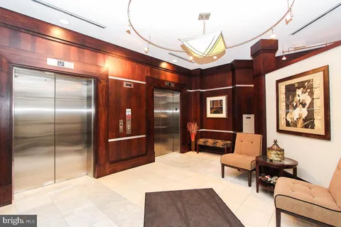 a lobby with furniture and window