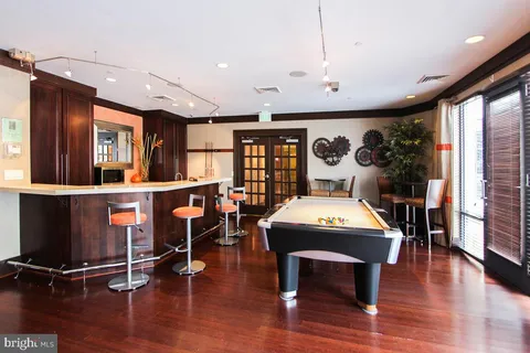 a view of a livingroom with furniture window and wooden floor