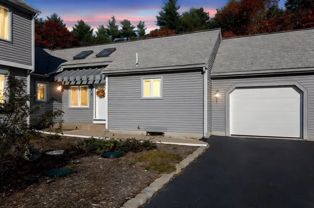 a aerial view of a house with a yard