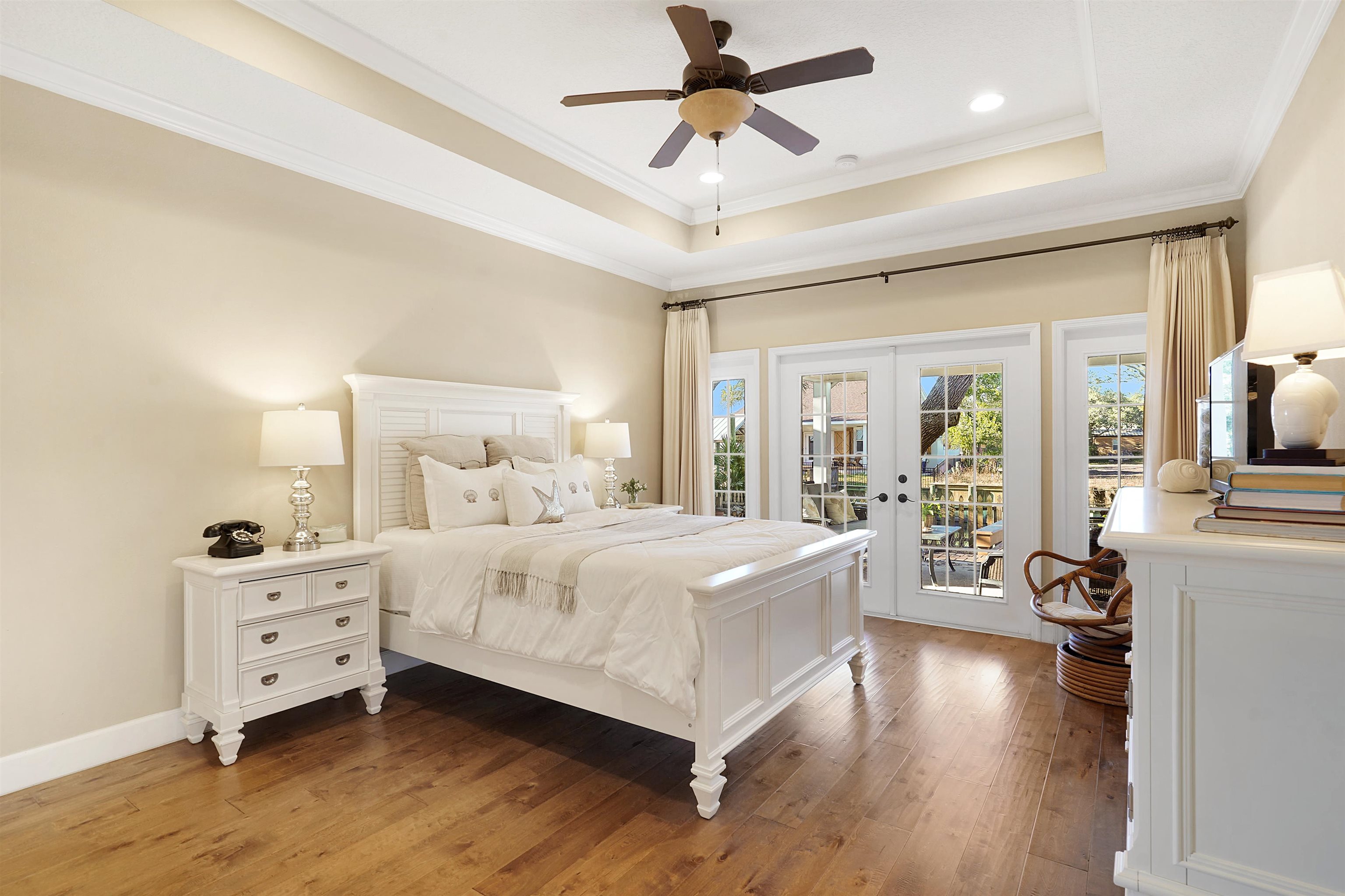248 Pizarro Road St. Augustine, FL 32080 - Photo 24 of 53 Bedroom featuring french doors, light wood finished floors, access to exterior, crown molding, and a ceiling fan