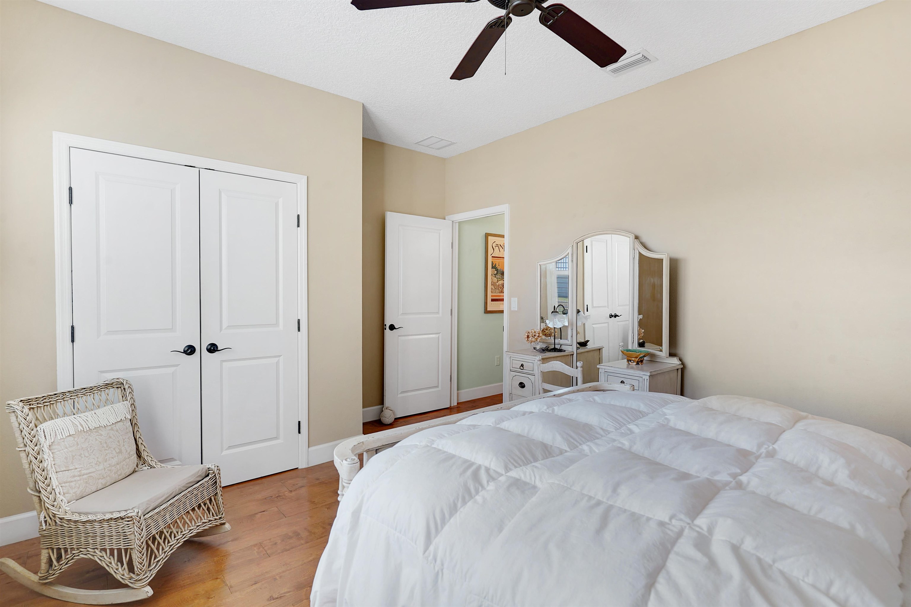 248 Pizarro Road St. Augustine, FL 32080 - Photo 31 of 53 Bedroom with a closet, wood finished floors, and a ceiling fan