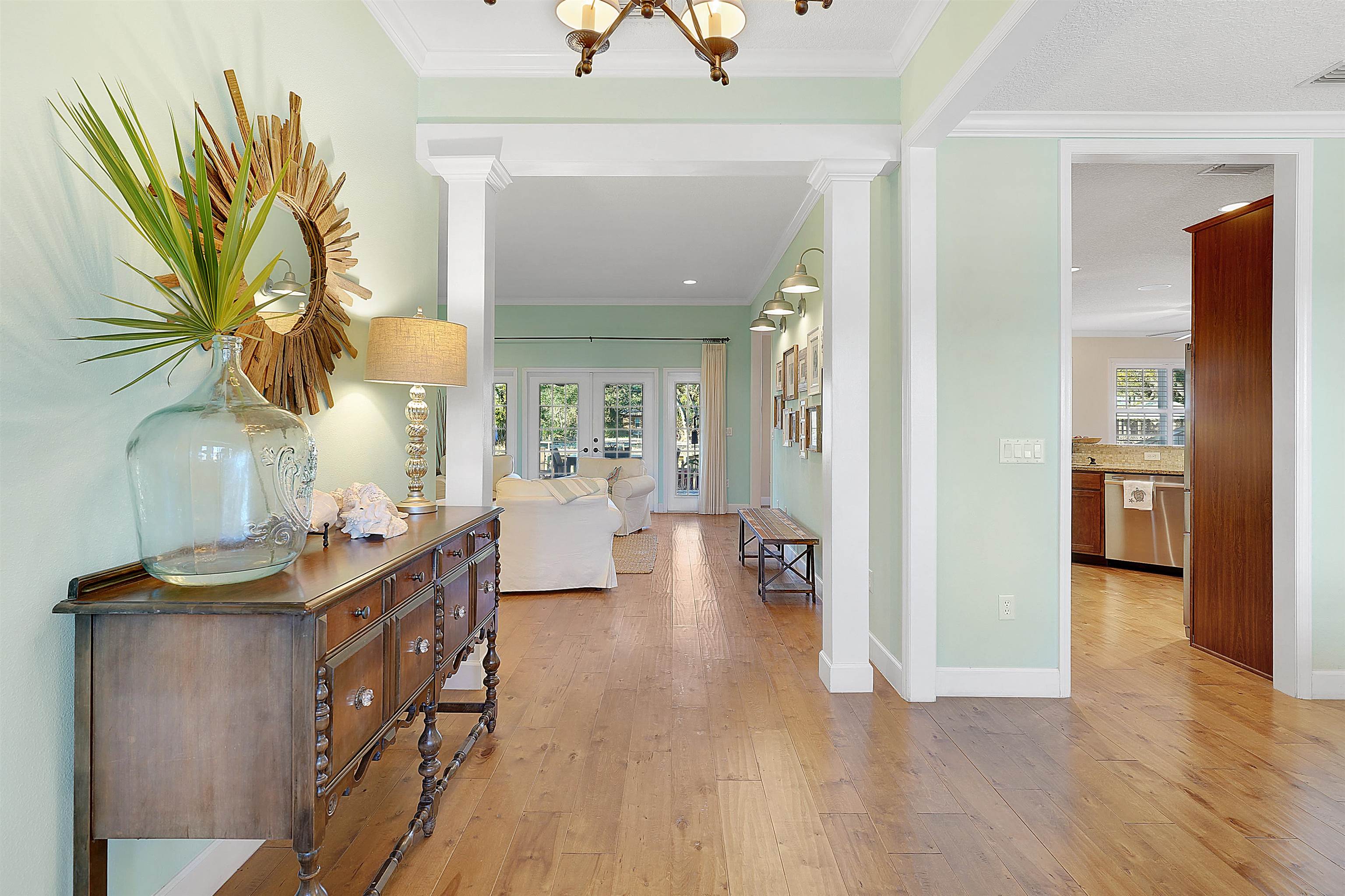 248 Pizarro Road St. Augustine, FL 32080 - Photo 8 of 53 Hall featuring light wood-type flooring, ornamental molding, and french doors