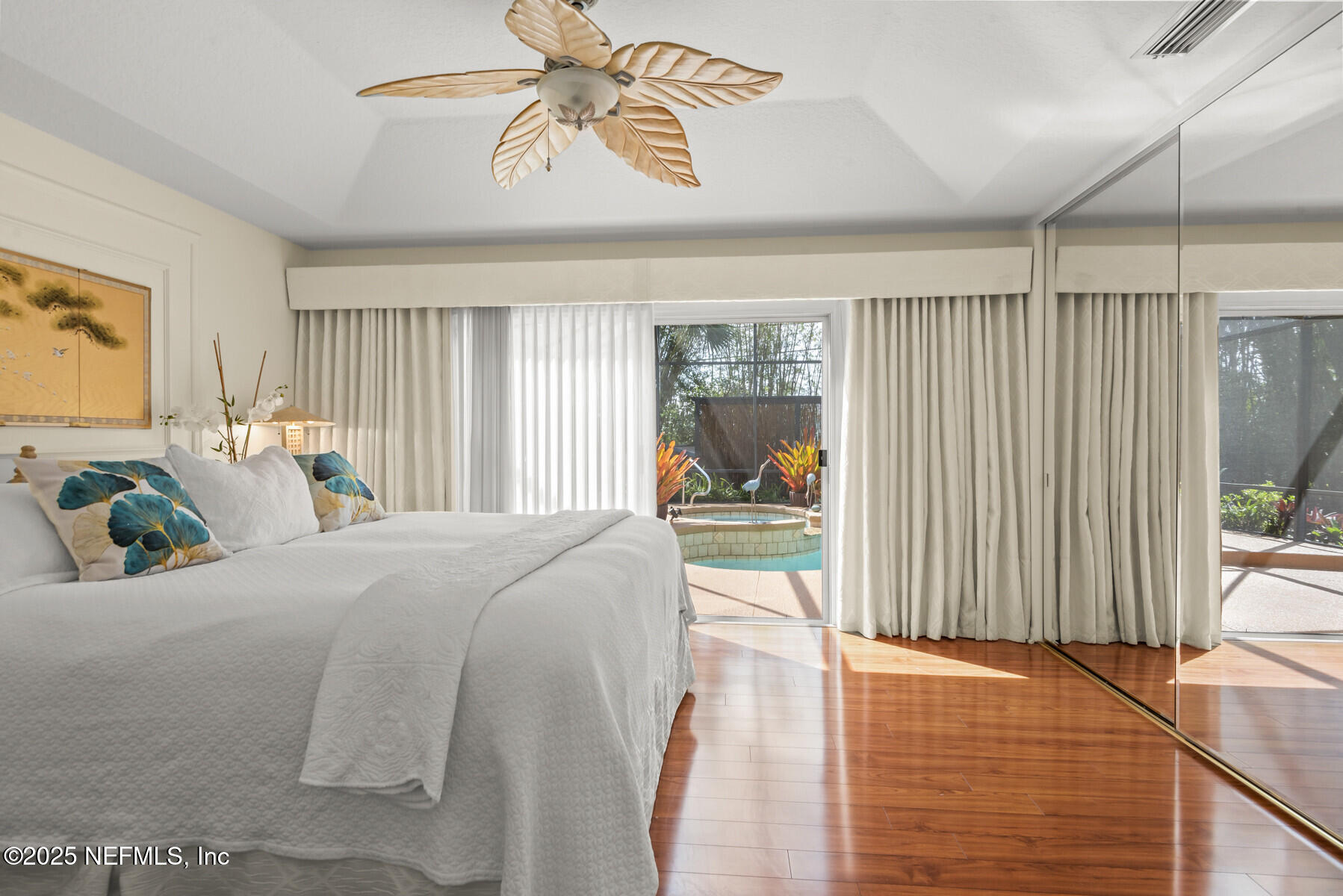 28 Spanish Waters Drive Ormond Beach, FL 32176 - Photo 12 of 44 a bed room with a bed mirror and a window