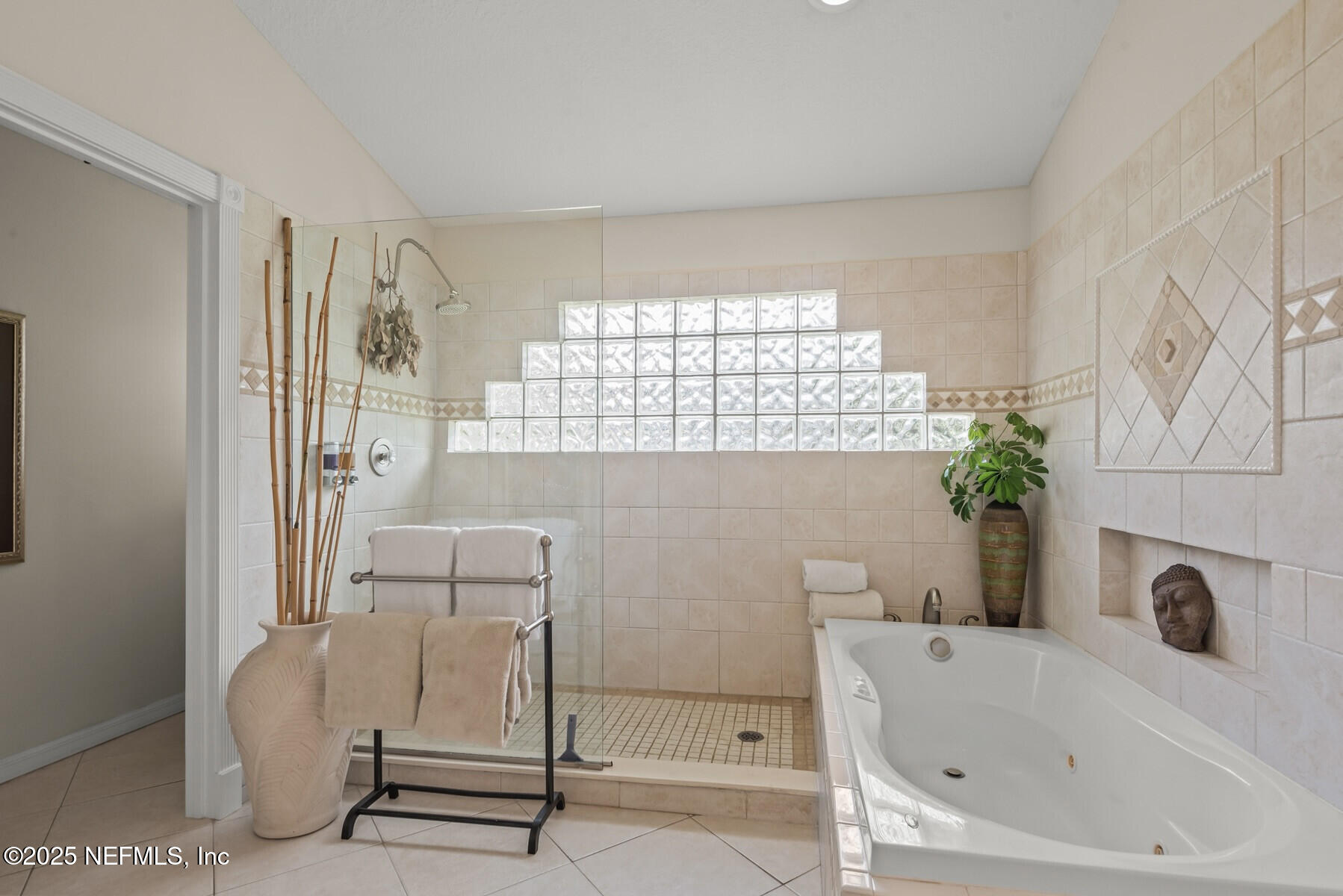 28 Spanish Waters Drive Ormond Beach, FL 32176 - Photo 13 of 44 a bathroom with a bathtub and a shower