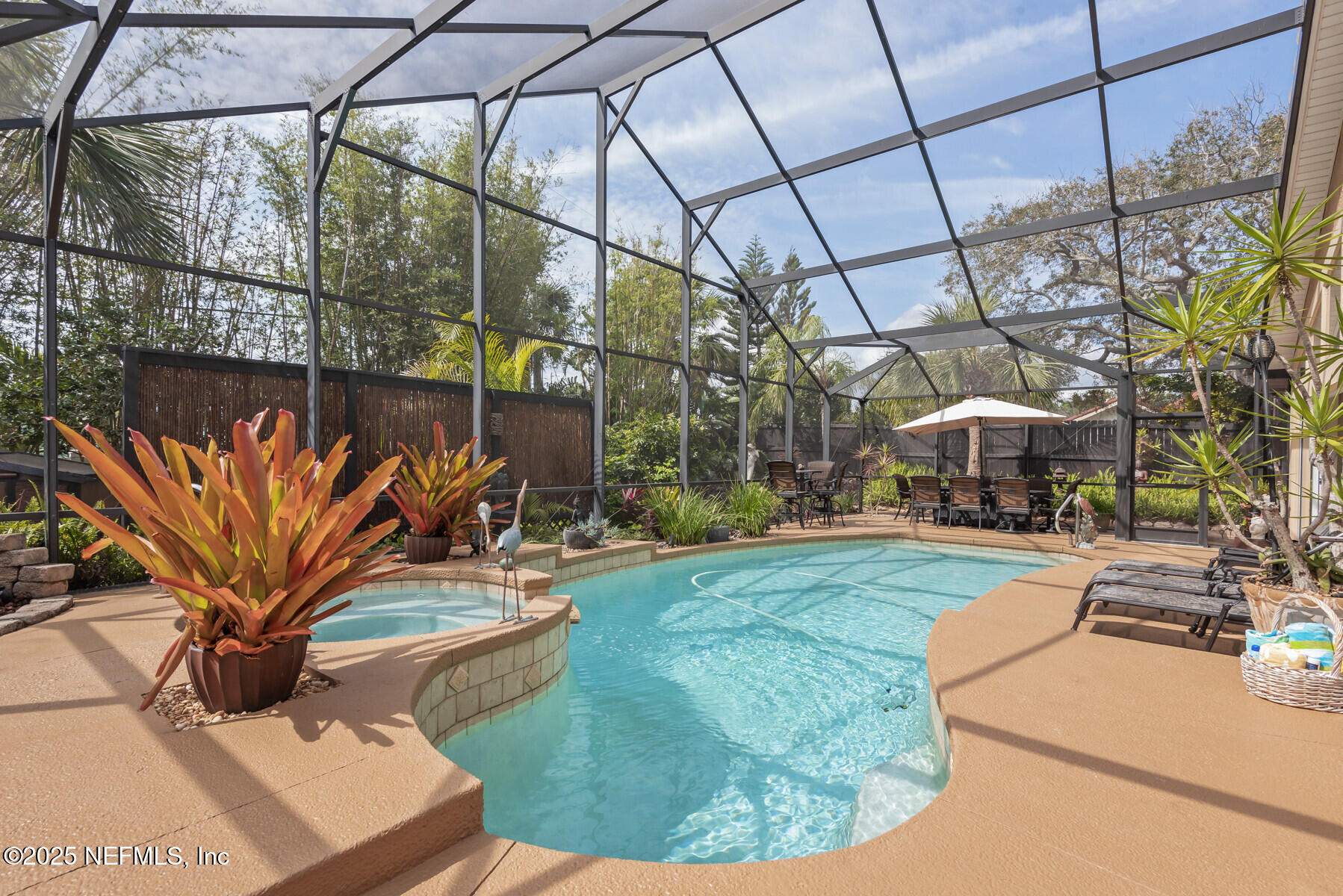28 Spanish Waters Drive Ormond Beach, FL 32176 - Photo 2 of 44 a view of a backyard with plants and a patio