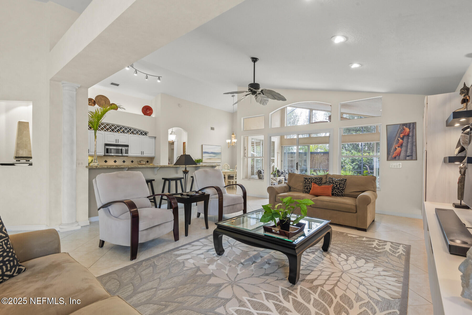 28 Spanish Waters Drive Ormond Beach, FL 32176 - Photo 21 of 44 a living room with furniture and a large window