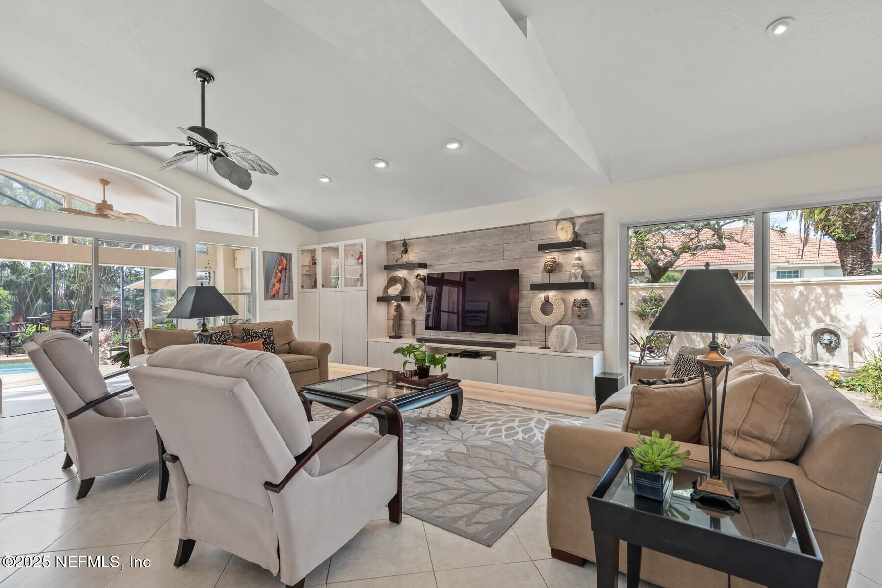 28 Spanish Waters Drive Ormond Beach, FL 32176 - Photo 23 of 44 a living room with furniture and a flat screen tv
