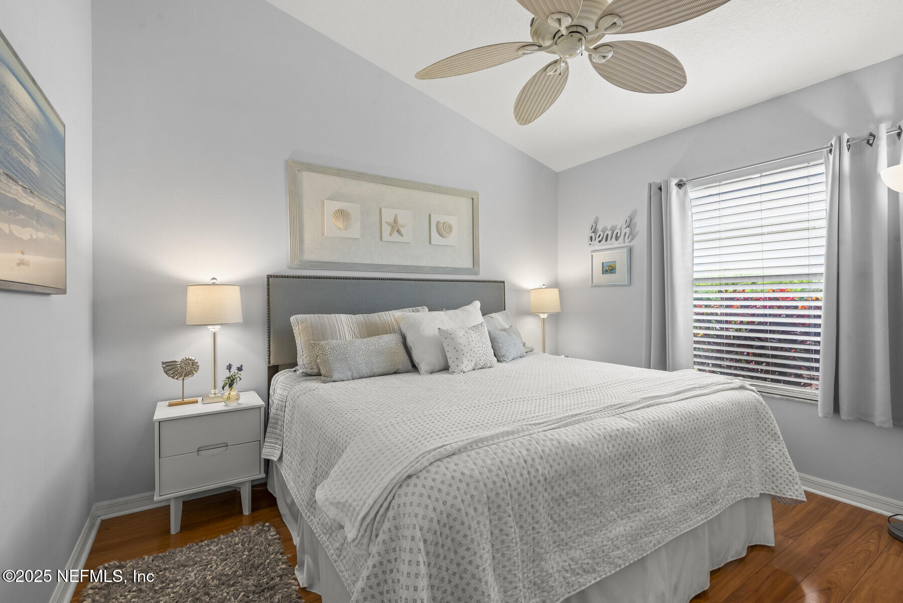 28 Spanish Waters Drive Ormond Beach, FL 32176 - Photo 25 of 44 a bedroom with a bed and a chandelier
