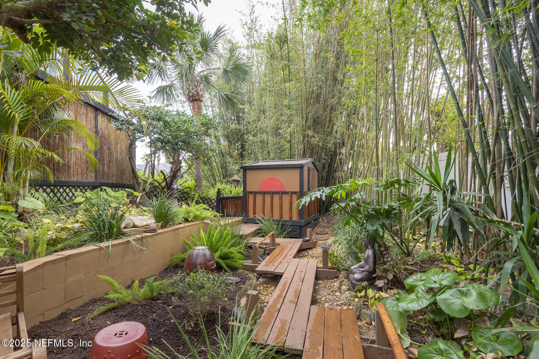28 Spanish Waters Drive Ormond Beach, FL 32176 - Photo 32 of 44 a view of backyard with plants and outdoor seating