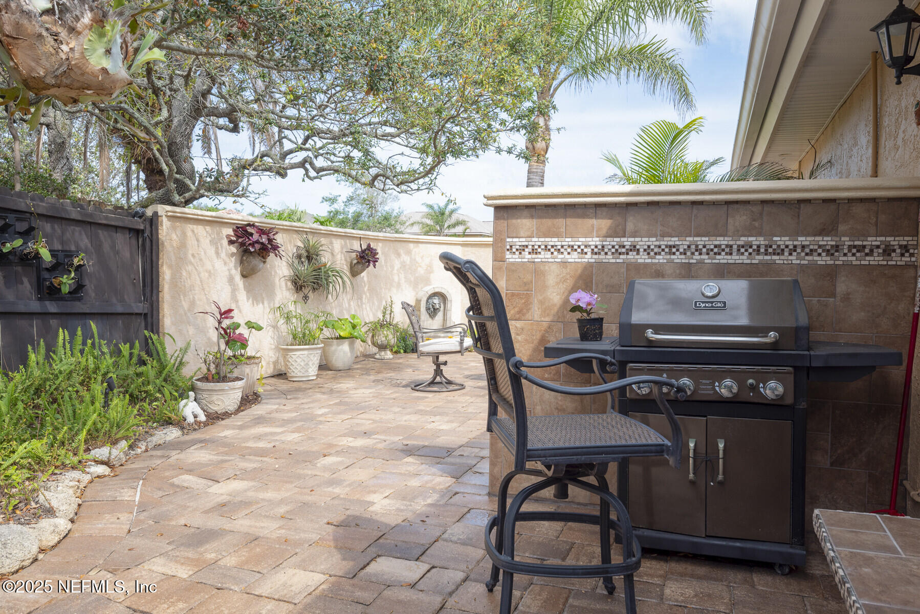 28 Spanish Waters Drive Ormond Beach, FL 32176 - Photo 33 of 44 a view of a chairs and table in the patio