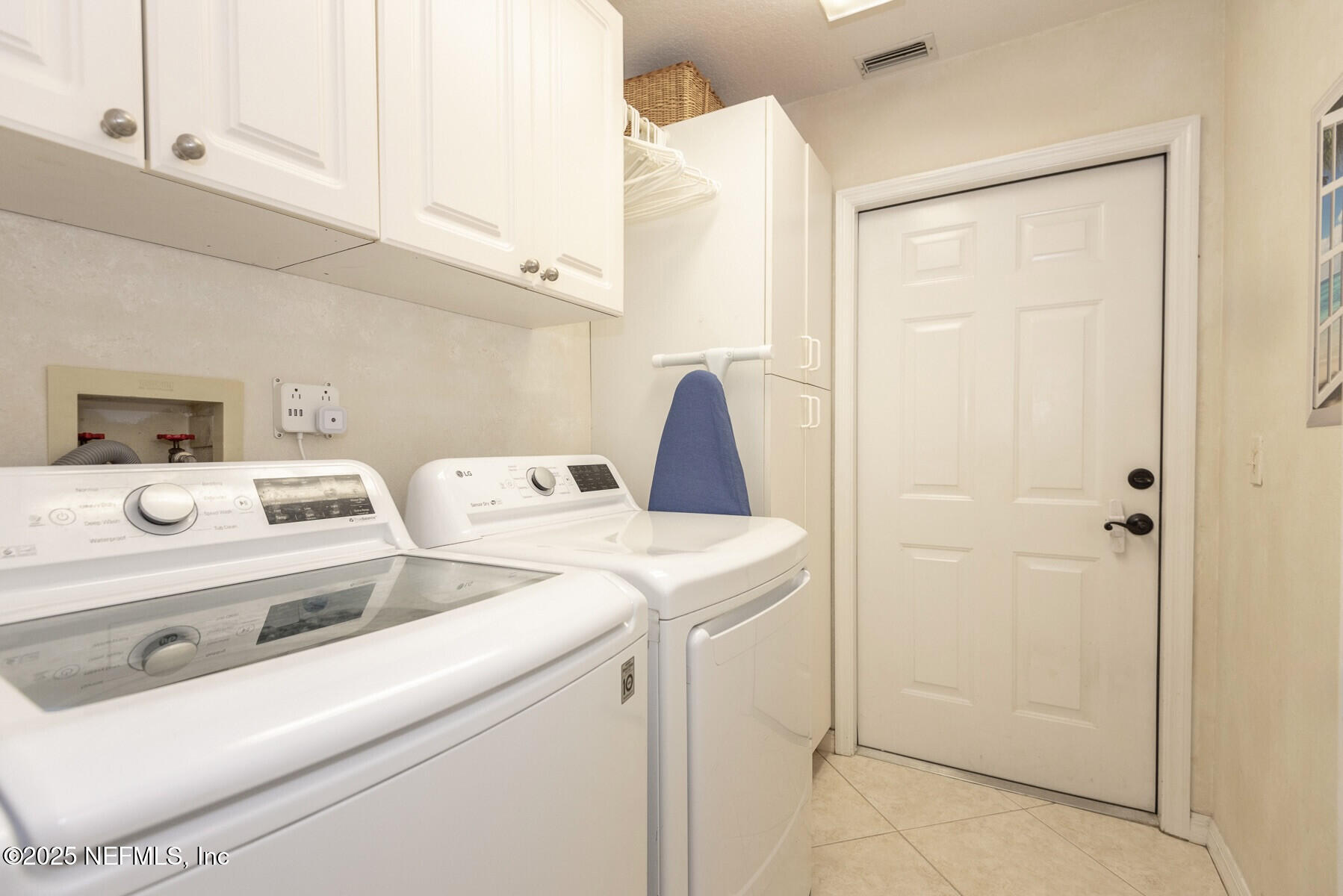 28 Spanish Waters Drive Ormond Beach, FL 32176 - Photo 36 of 44 a utility room with dryer and washer