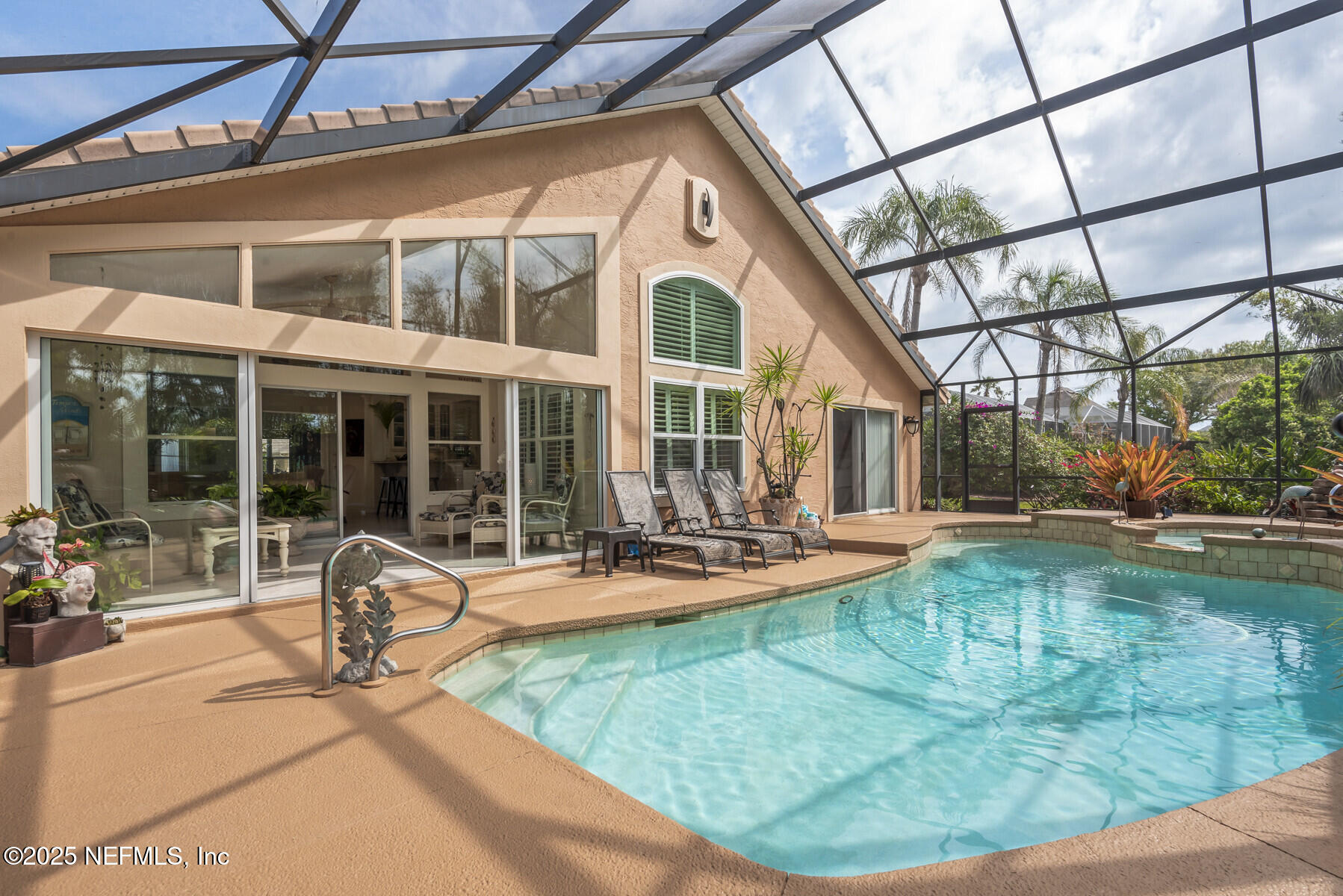 28 Spanish Waters Drive Ormond Beach, FL 32176 - Photo 4 of 44 a view of a house with backyard sitting area and porch