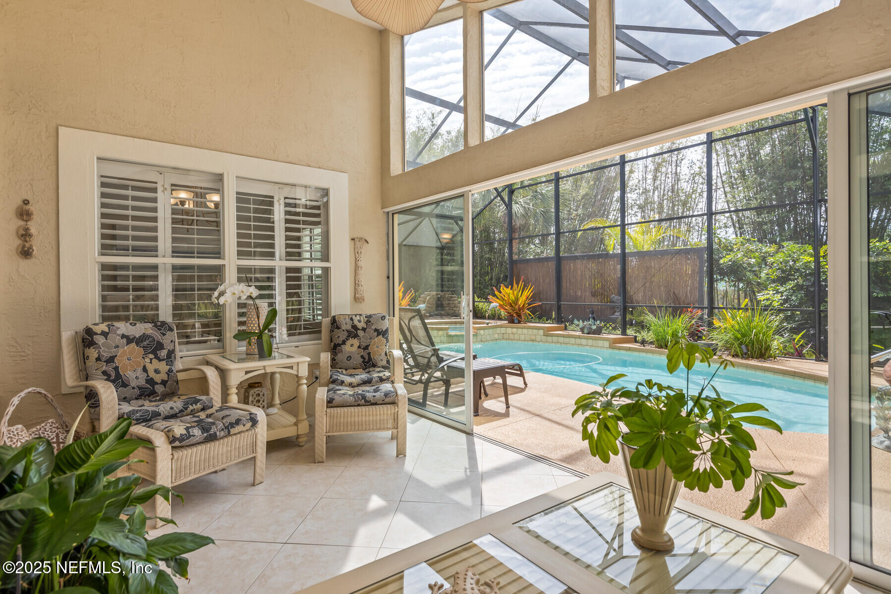 28 Spanish Waters Drive Ormond Beach, FL 32176 - Photo 6 of 44 a living room filled with furniture and a large window