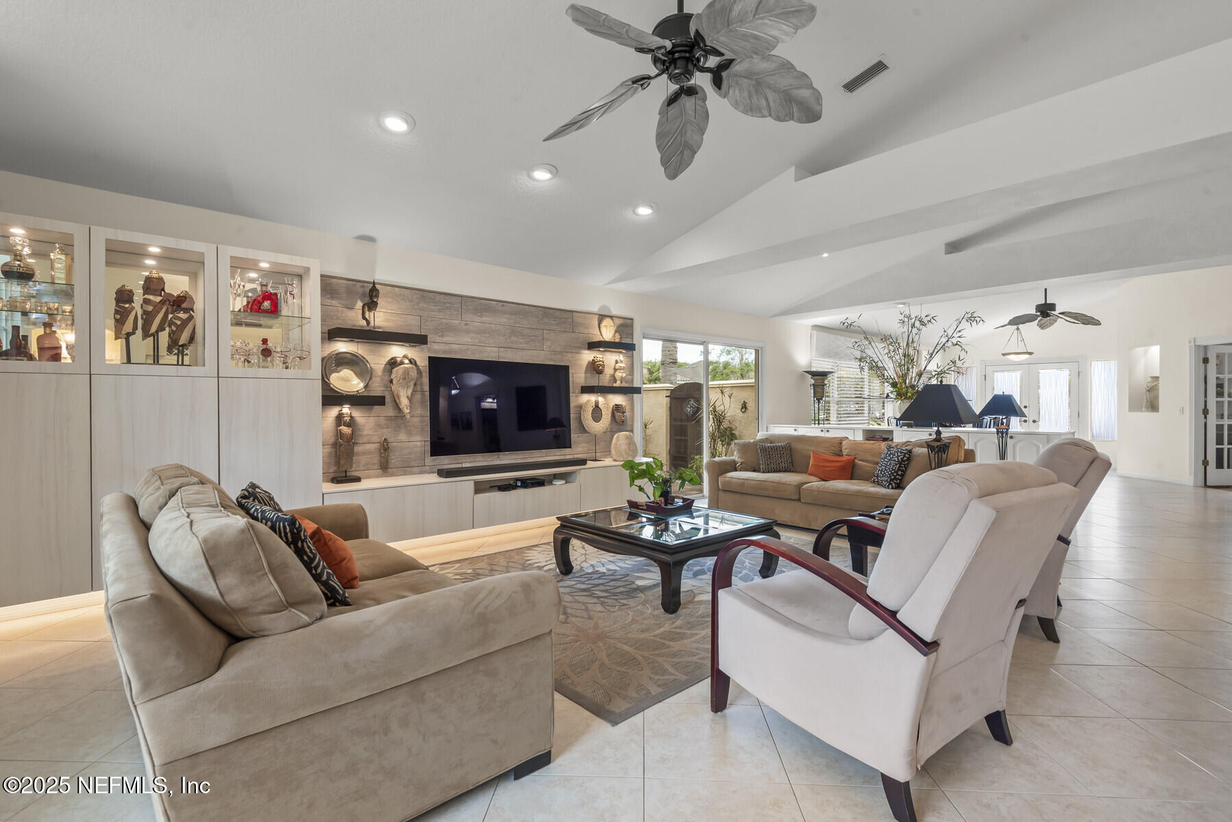 28 Spanish Waters Drive Ormond Beach, FL 32176 - Photo 8 of 44 a living room with furniture and a flat screen tv