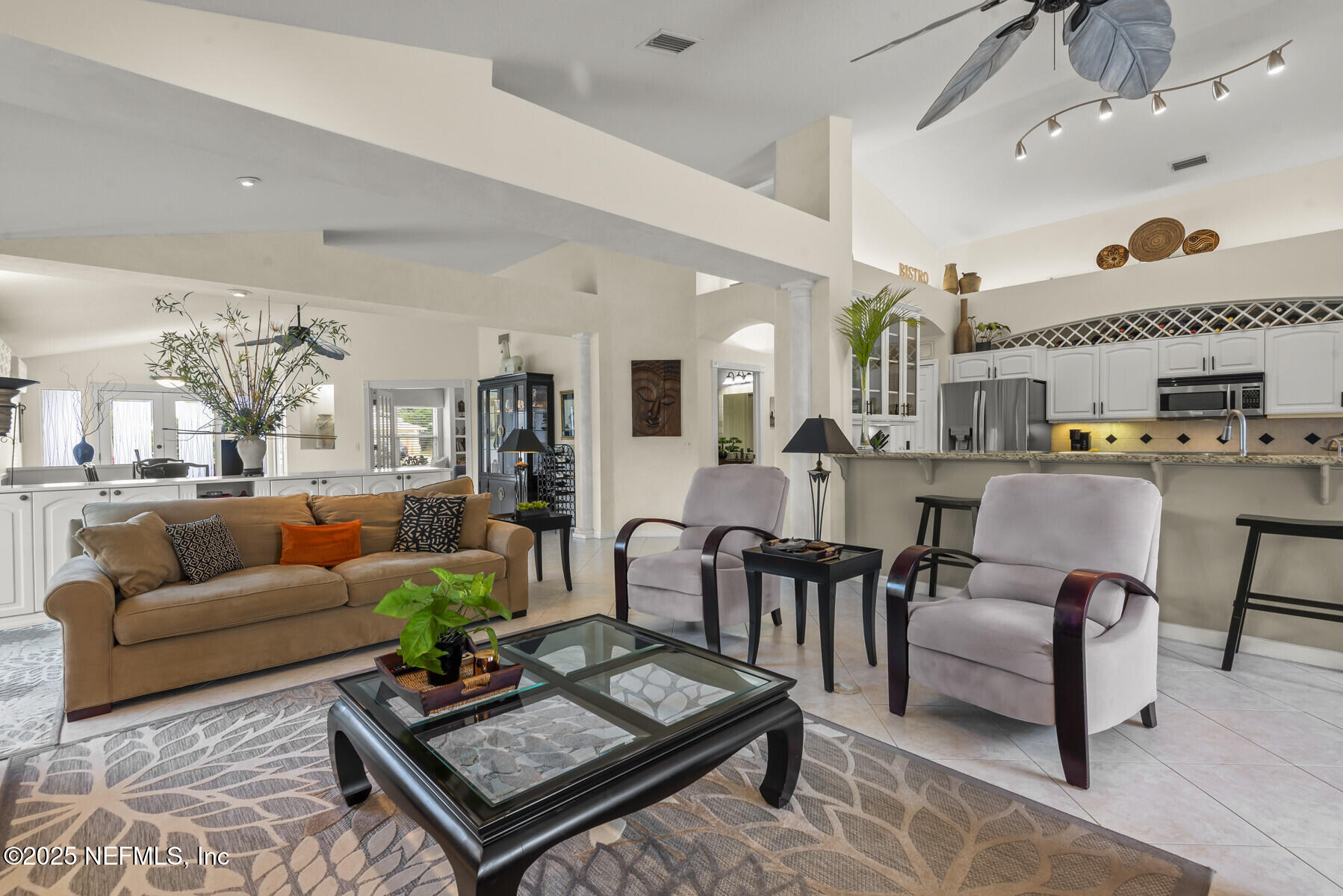 28 Spanish Waters Drive Ormond Beach, FL 32176 - Photo 9 of 44 a living room with furniture and a table