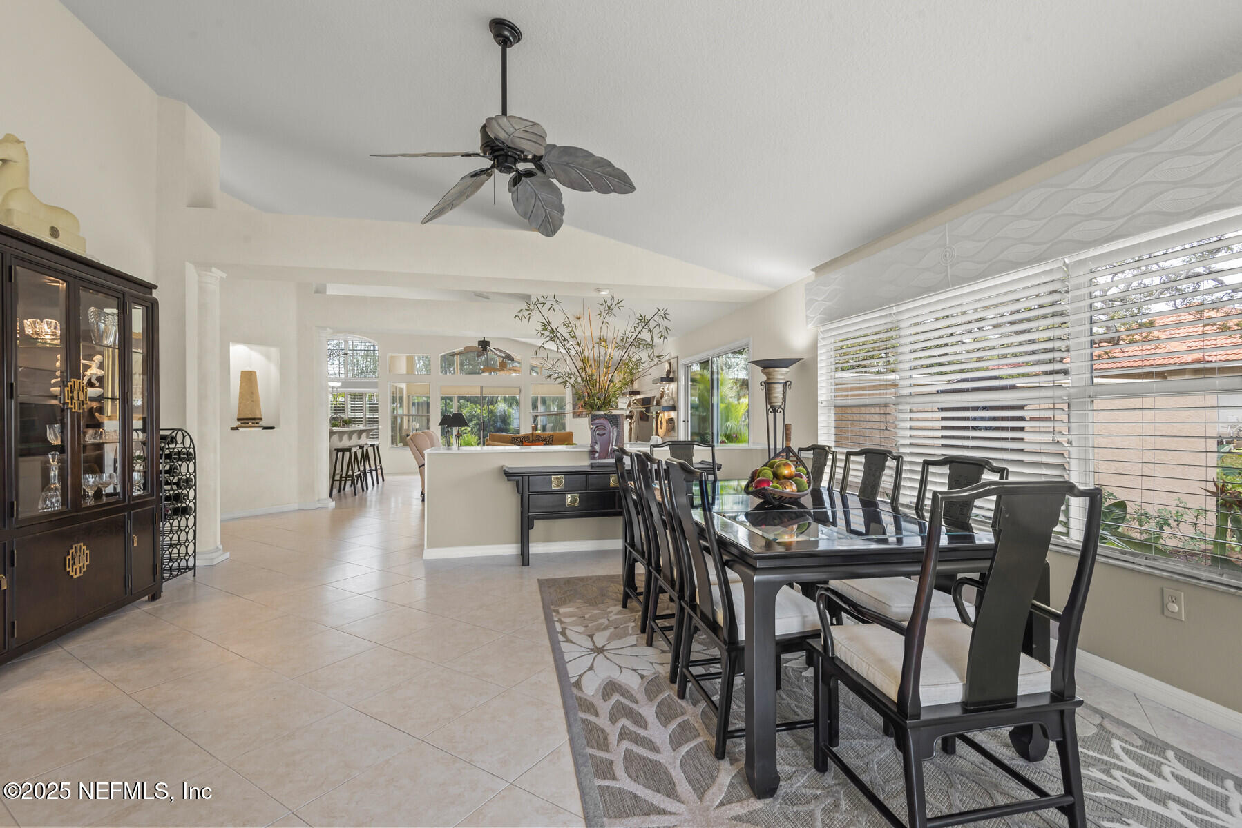 28 Spanish Waters Drive Ormond Beach, FL 32176 - Photo 10 of 44 a view of a dining room and livingroom with furniture window and wooden floor