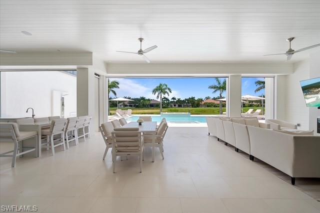 6285 Highcroft Drive Naples, FL 34119 - Photo 19 of 50 a dining room with furniture a garden and outdoor view