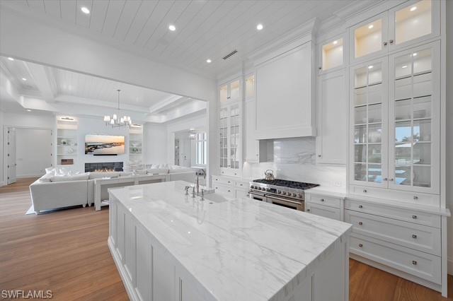 6285 Highcroft Drive Naples, FL 34119 - Photo 20 of 50 a kitchen with stainless steel appliances granite countertop a stove and a sink