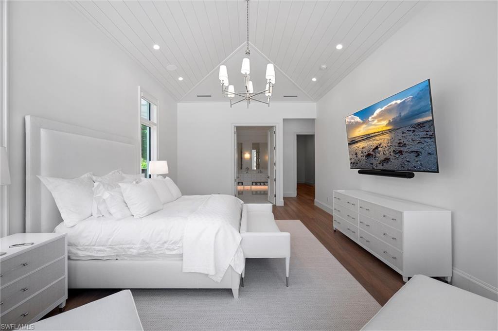 6285 Highcroft Drive Naples, FL 34119 - Photo 29 of 50 a living room with furniture and a flat screen tv