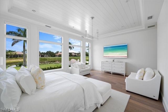 6285 Highcroft Drive Naples, FL 34119 - Photo 33 of 50 a bedroom with a bed couch and window