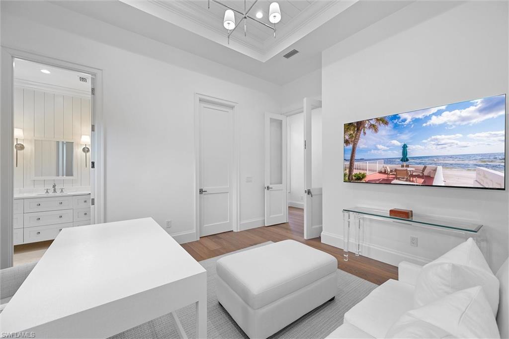 6285 Highcroft Drive Naples, FL 34119 - Photo 34 of 50 a living room with furniture and a view of kitchen