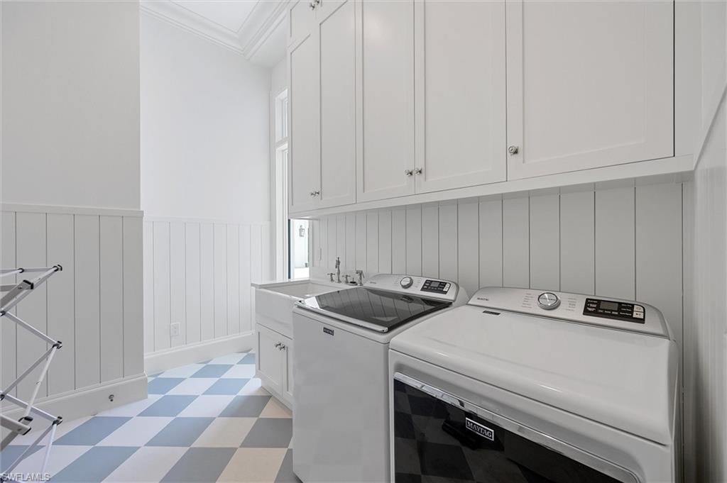 6285 Highcroft Drive Naples, FL 34119 - Photo 43 of 50 a utility room with dryer and washer