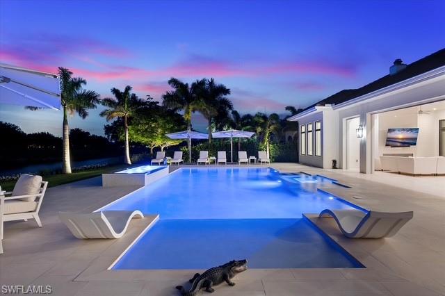 6285 Highcroft Drive Naples, FL 34119 - Photo 5 of 50 a view of a pool with furniture