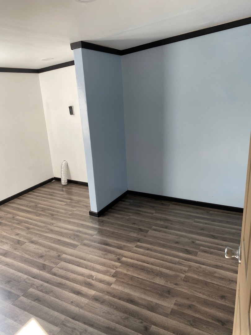 405 6th Street Mendota, IL 61342 - Photo 17 of 21 a view of an empty room with wooden floor