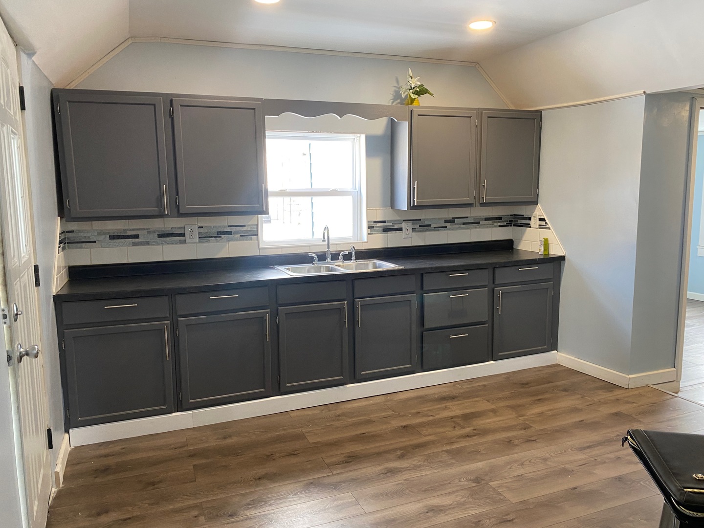 405 6th Street Mendota, IL 61342 - Photo 5 of 21 a kitchen with stainless steel appliances granite countertop a sink and cabinets with wooden floor