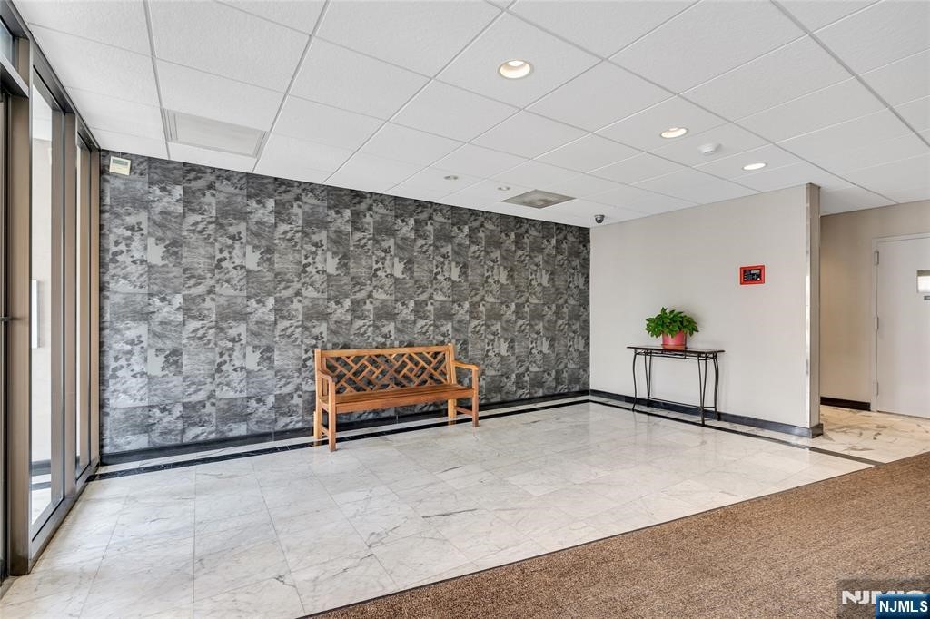 233 12th Street, Unit 3H Palisades Park, NJ 07650 - Photo 3 of 10 a living room with a couch