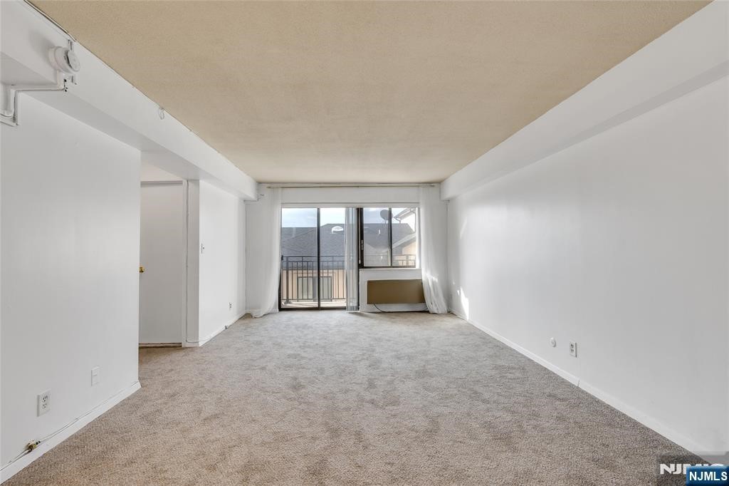 233 12th Street, Unit 3H Palisades Park, NJ 07650 - Photo 5 of 10 a view of an empty room with a window
