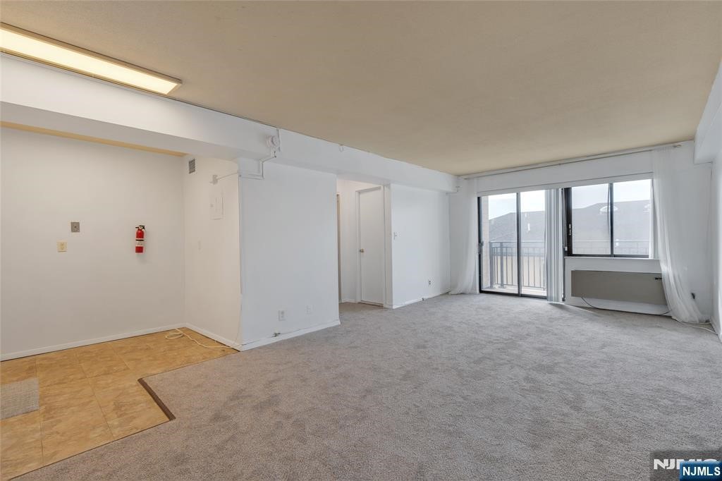 233 12th Street, Unit 3H Palisades Park, NJ 07650 - Photo 6 of 10 a view of an empty room with a window
