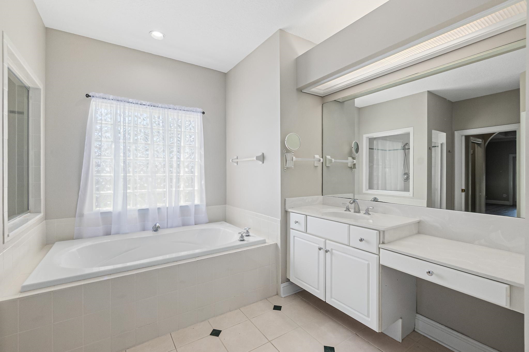 Undisclosed Address St. Augustine, FL 32080 - Photo 26 of 58 a spacious bathroom with sink shower and bathtub