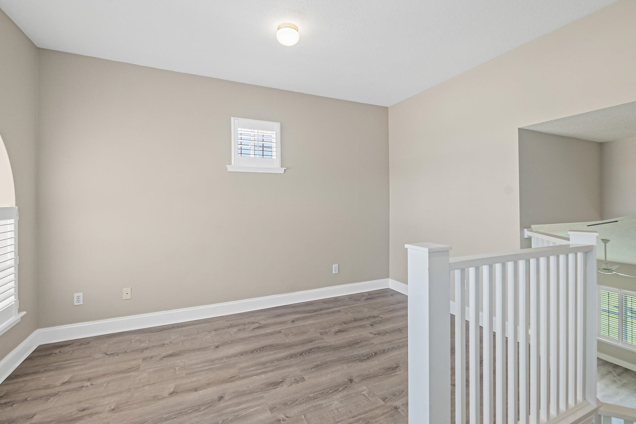 Undisclosed Address St. Augustine, FL 32080 - Photo 32 of 58 a view of an empty room with wooden floor