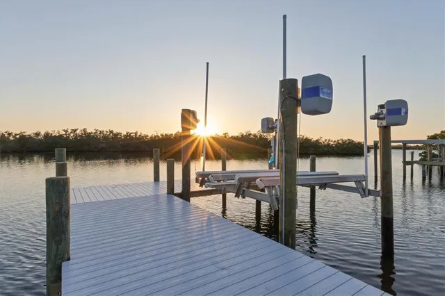 a view of a lake with boats and trees