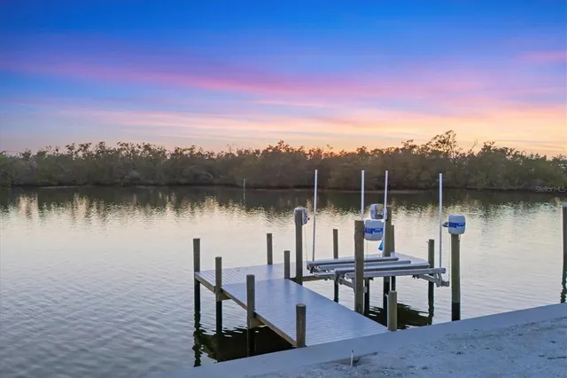 a view of a lake with sitting area