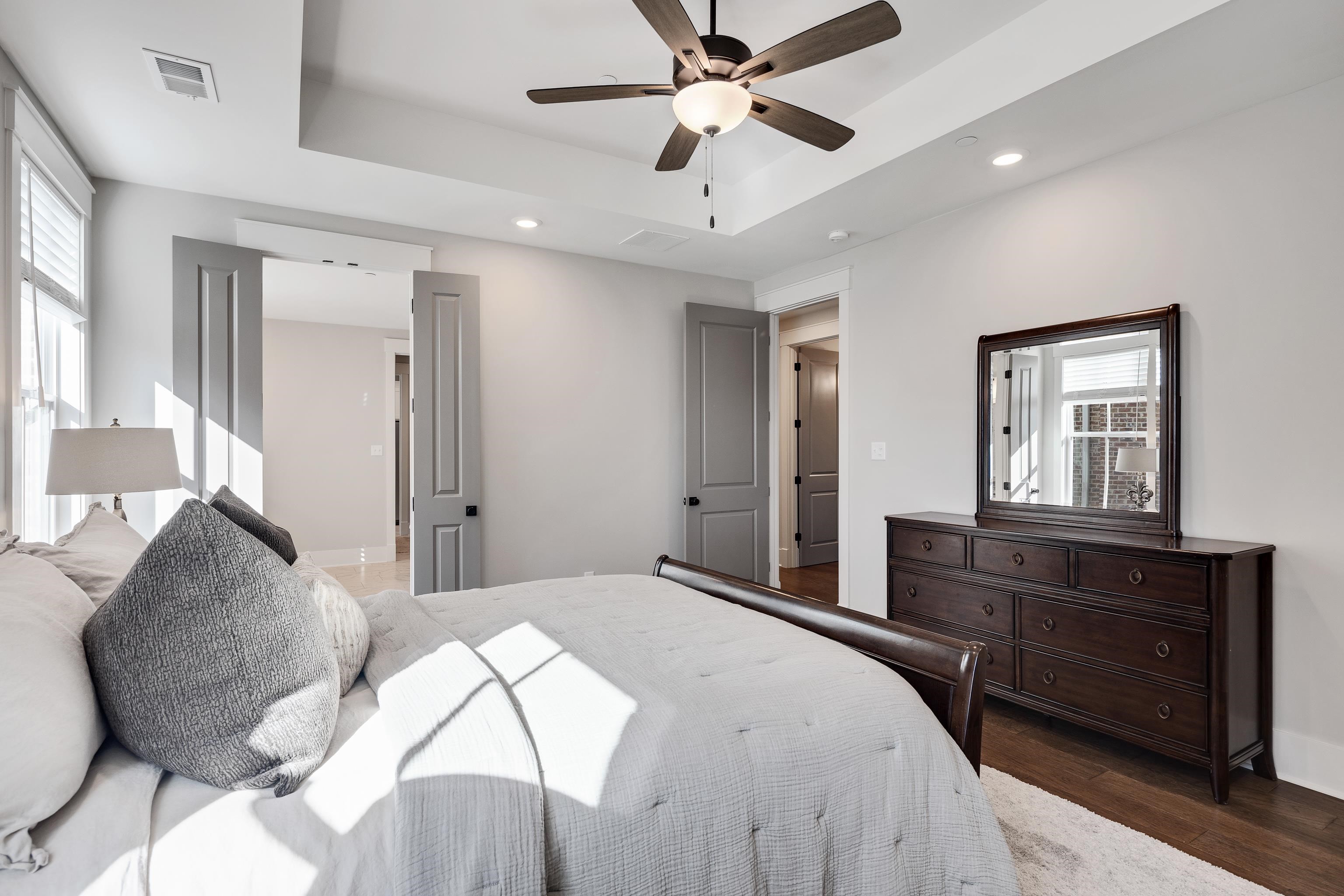 60 Old Pasture Lane Collierville, TN 38017 - Photo 21 of 36 a bedroom with a large bed and a dresser