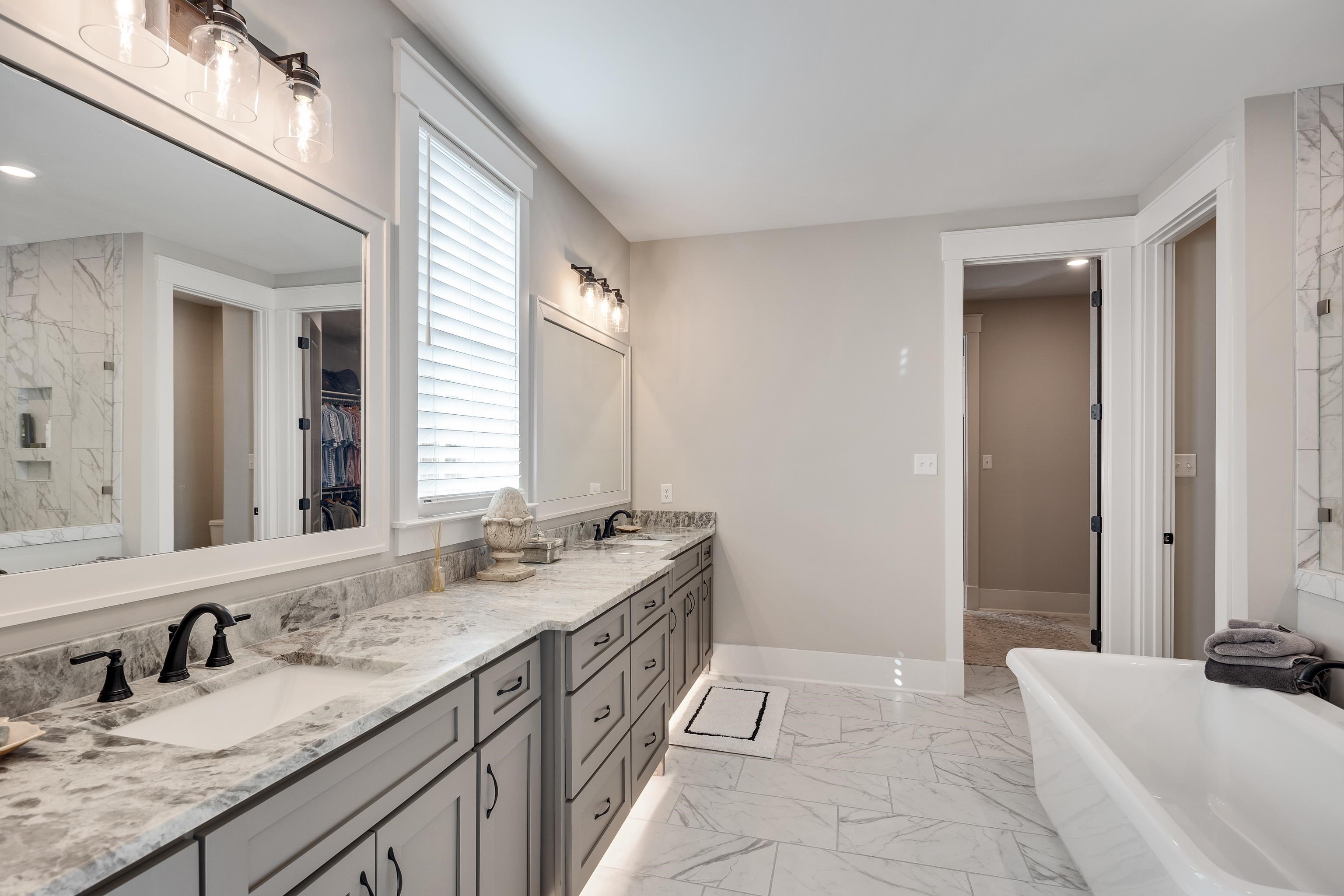 60 Old Pasture Lane Collierville, TN 38017 - Photo 22 of 36 a bathroom with a granite countertop sink and a bathtub