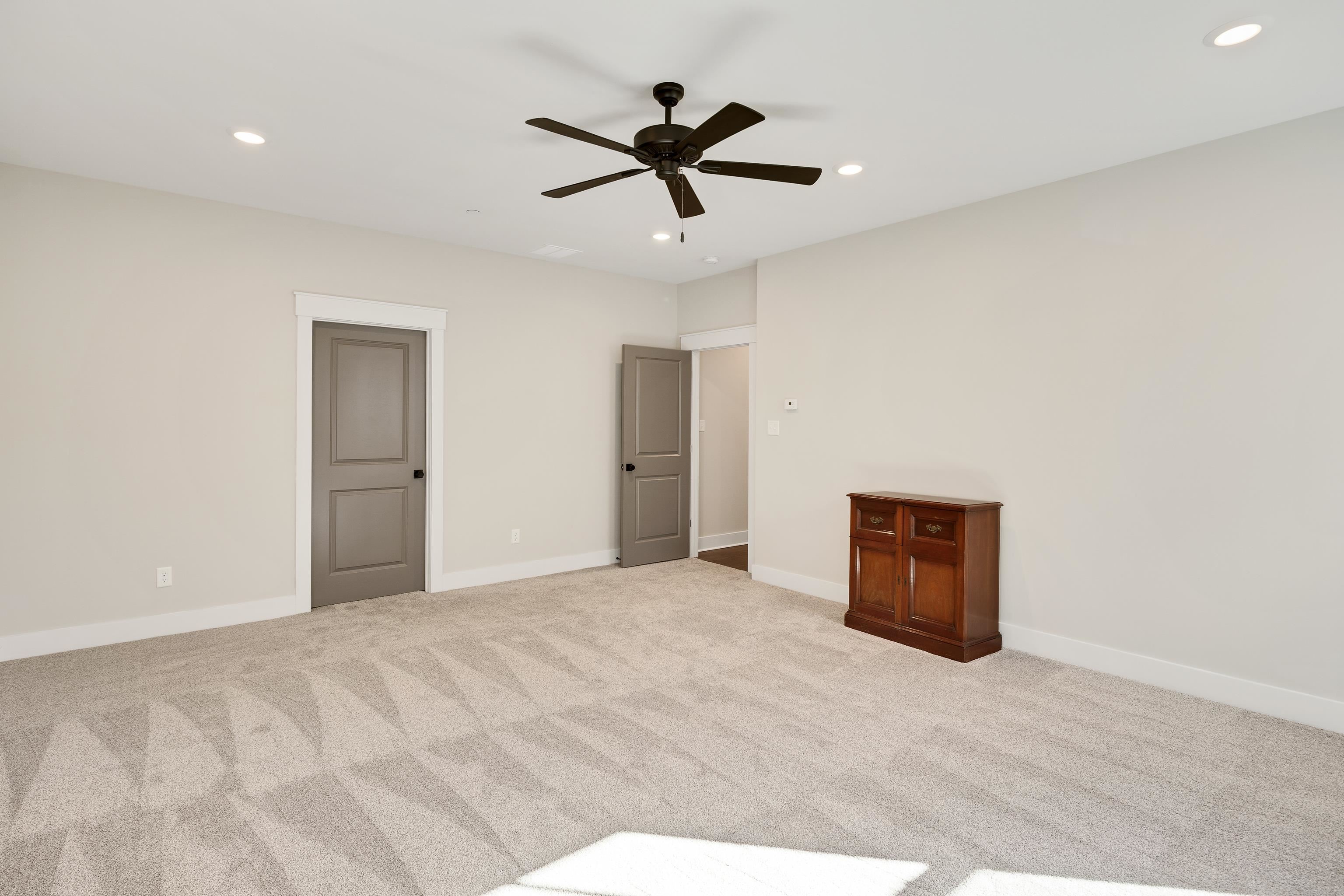60 Old Pasture Lane Collierville, TN 38017 - Photo 32 of 36 a view of a big room with wooden floor and a ceiling fan