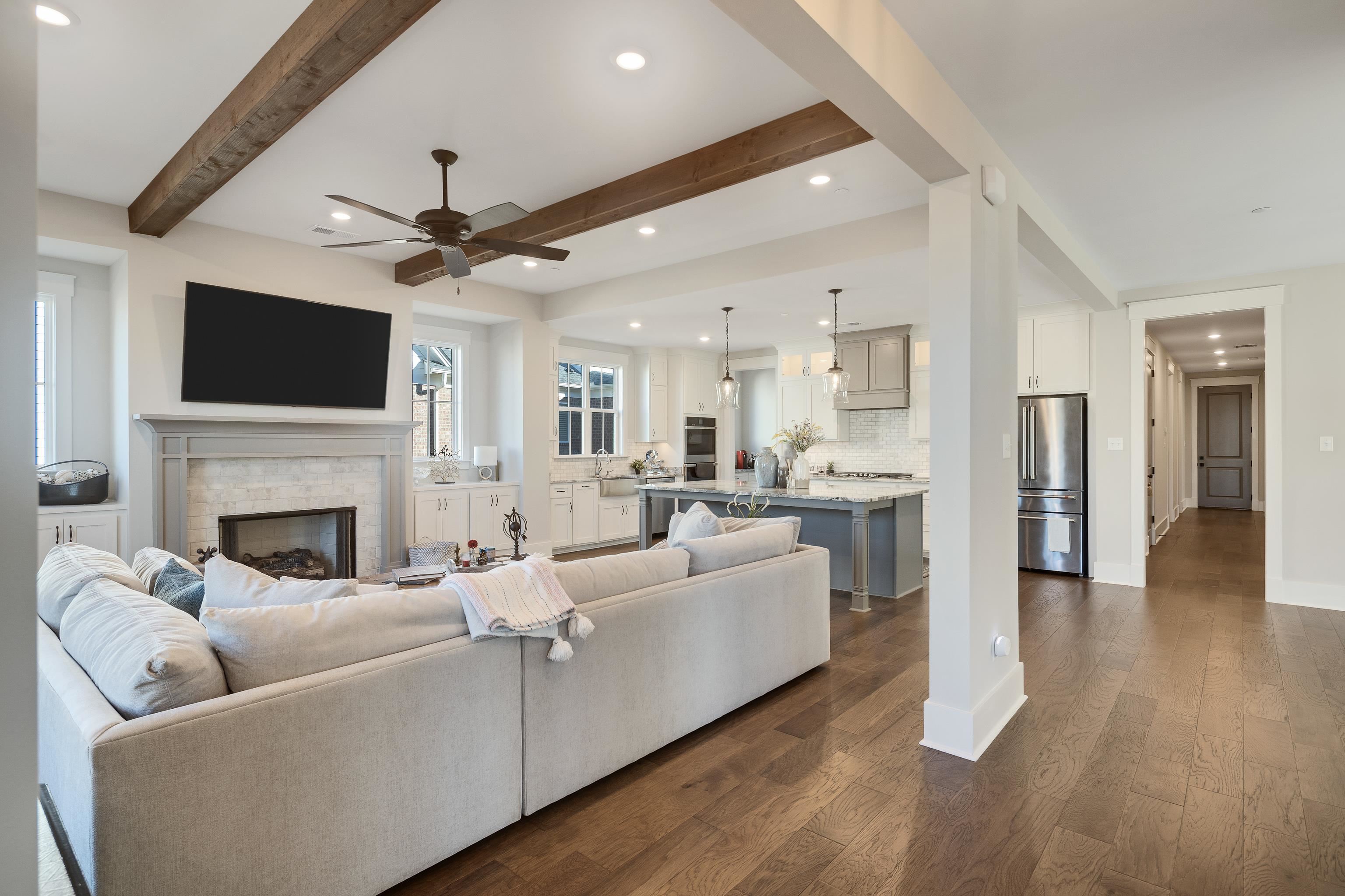 60 Old Pasture Lane Collierville, TN 38017 - Photo 5 of 36 a living room with furniture a fireplace and a flat screen tv