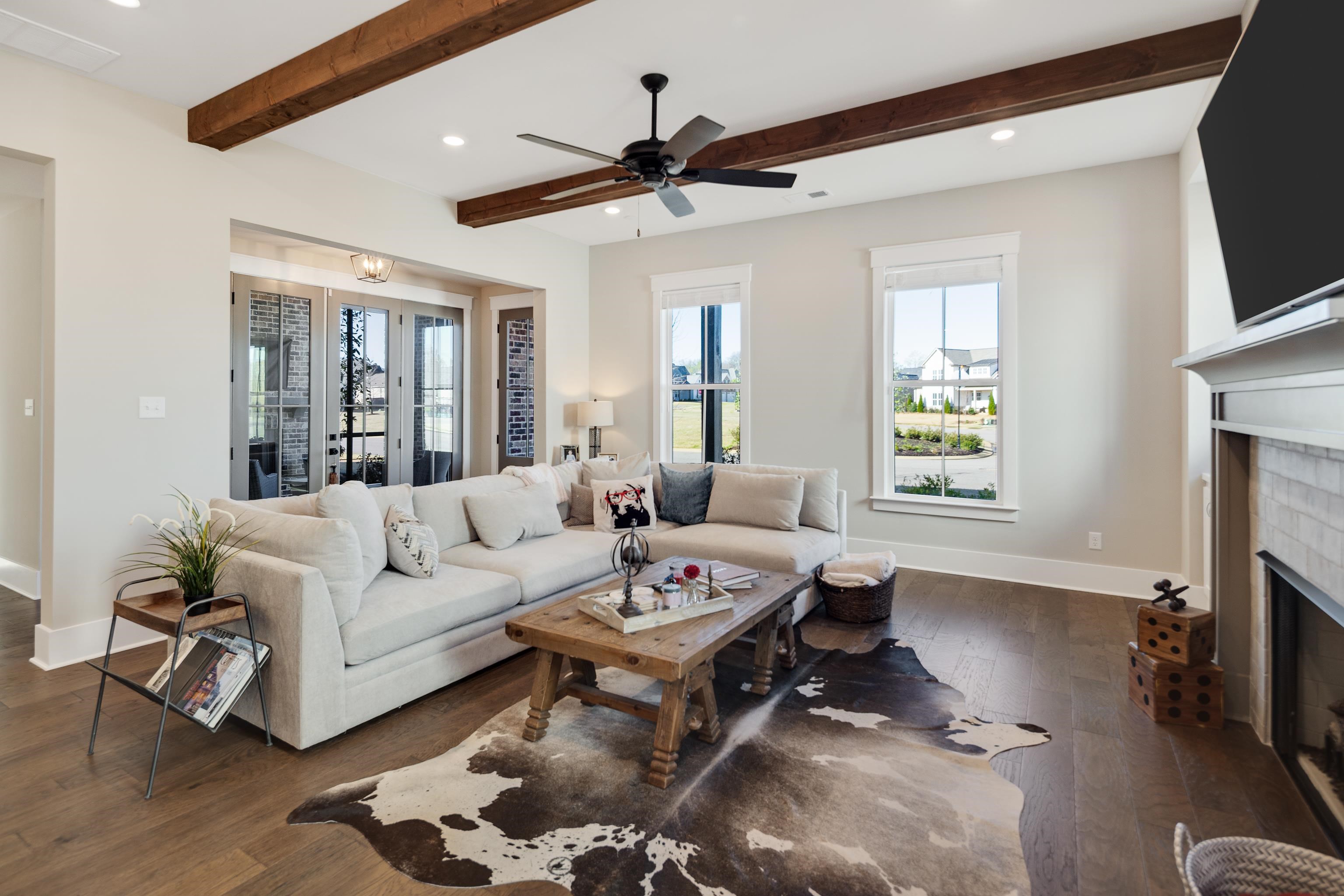 60 Old Pasture Lane Collierville, TN 38017 - Photo 8 of 36 a living room with furniture a fireplace and a flat screen tv