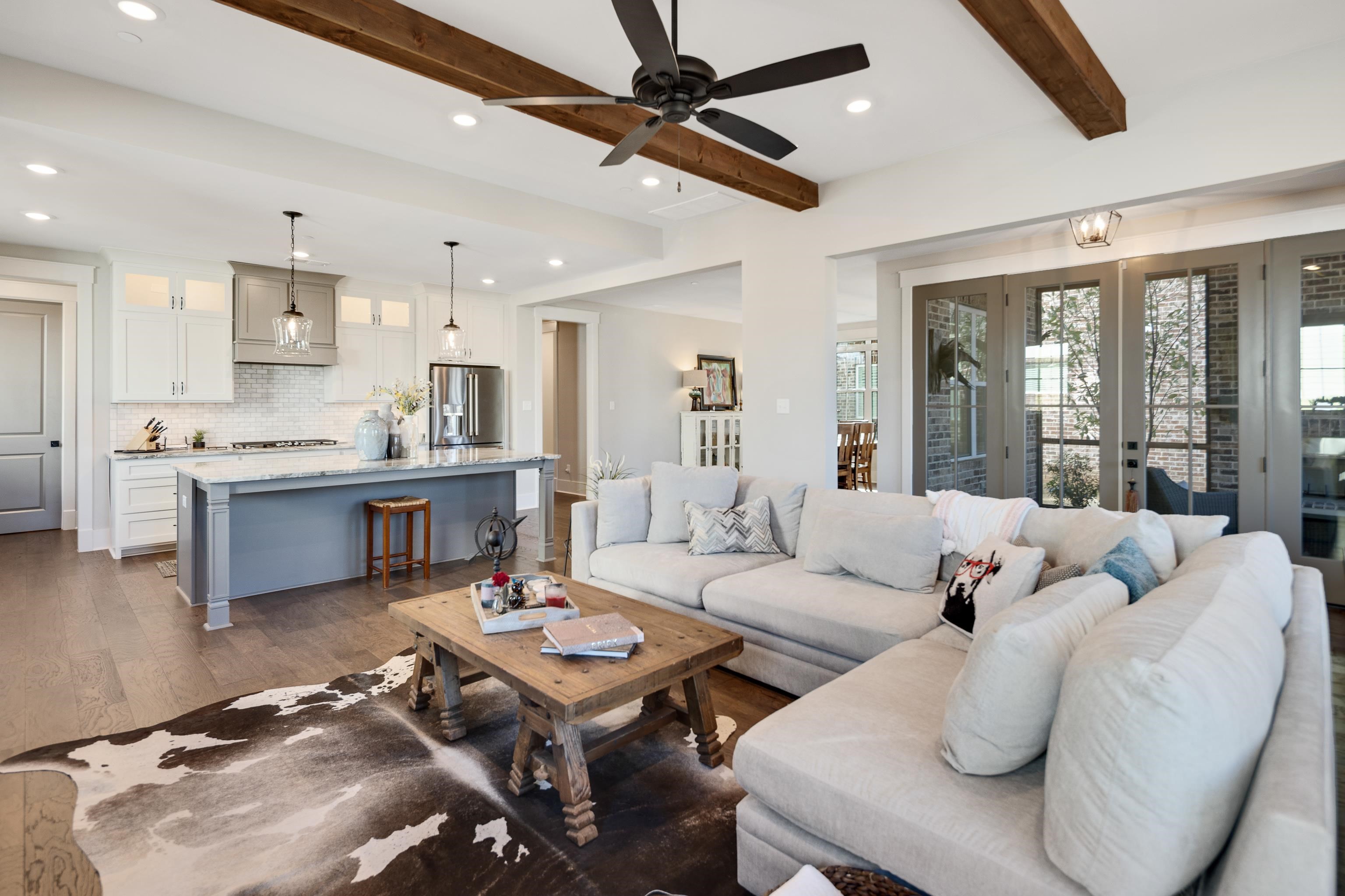 60 Old Pasture Lane Collierville, TN 38017 - Photo 9 of 36 a living room with furniture kitchen view and a large window