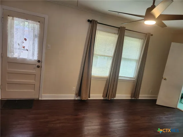 a view of gallery with wooden floor