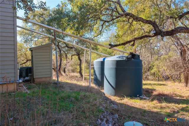 a view of a lake with a yard