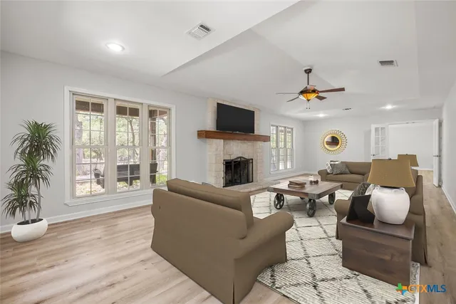 a view of kitchen with wooden floor and electronic appliances
